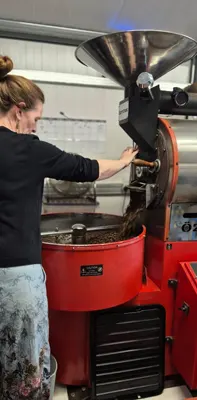 Grace finishing a coffee roast